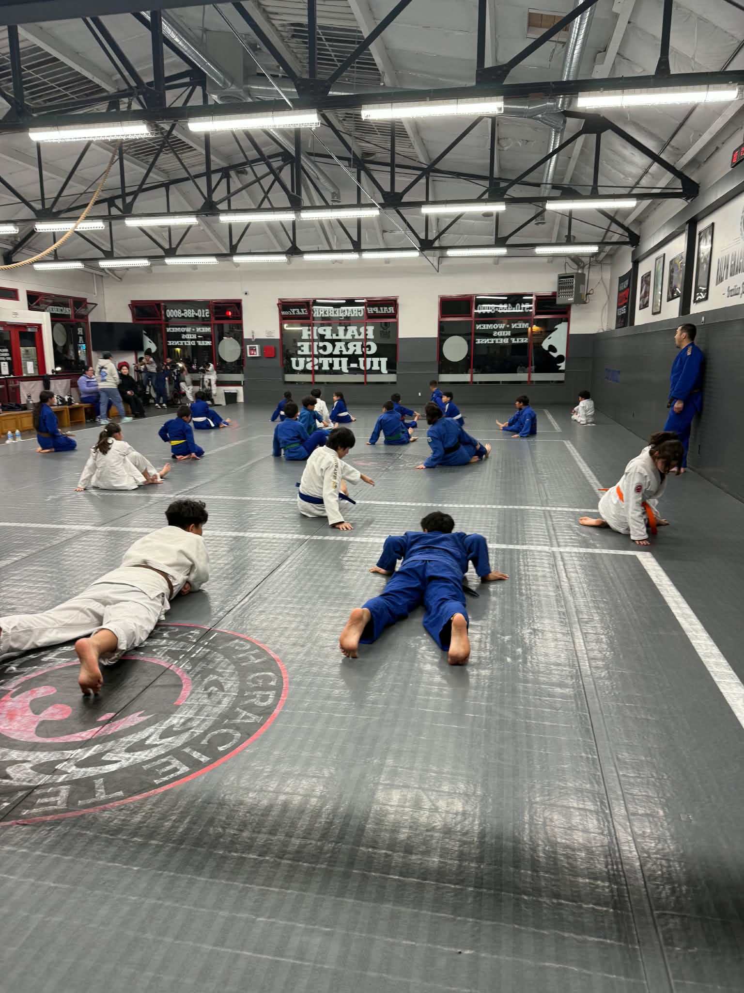 Children warming up on the dojo mats