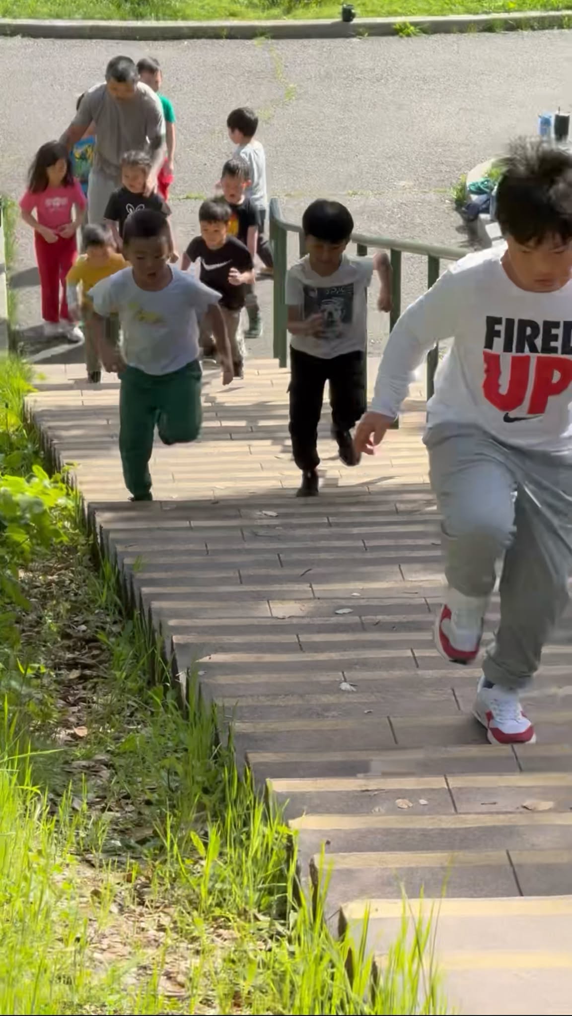 Club members running up outdoor stairs