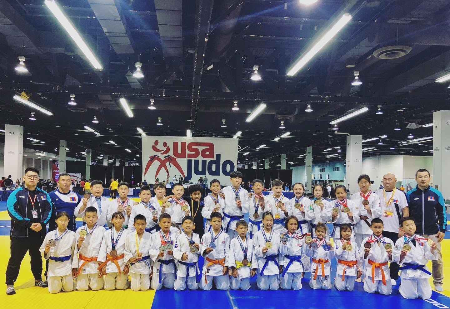 Genco judo students and coaches together at a competition